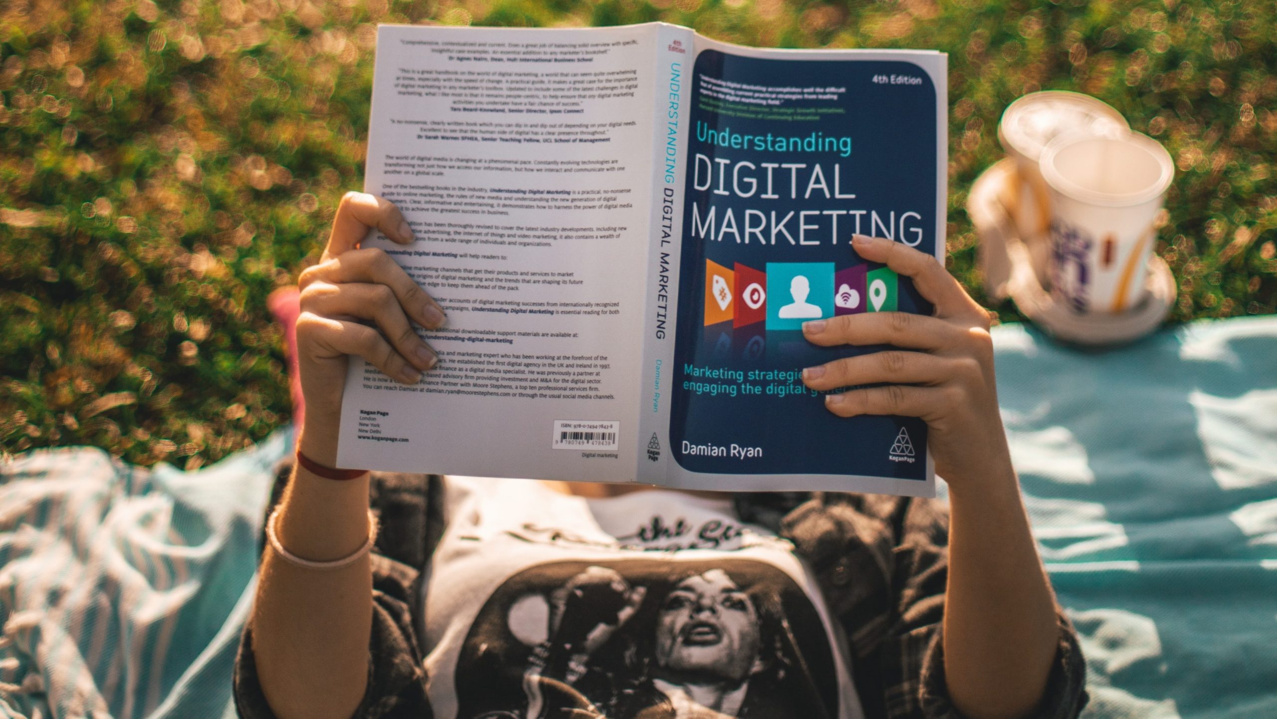 A person reading a book about digital marketing